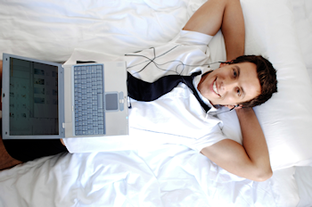 businessman working from own bedroom