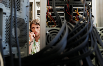Technician making call from server room