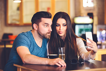 Man and woman taking a selfie