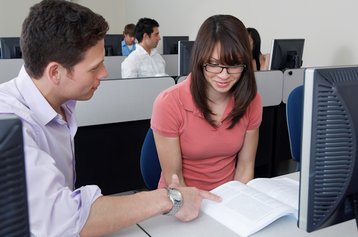 man tutoring a student